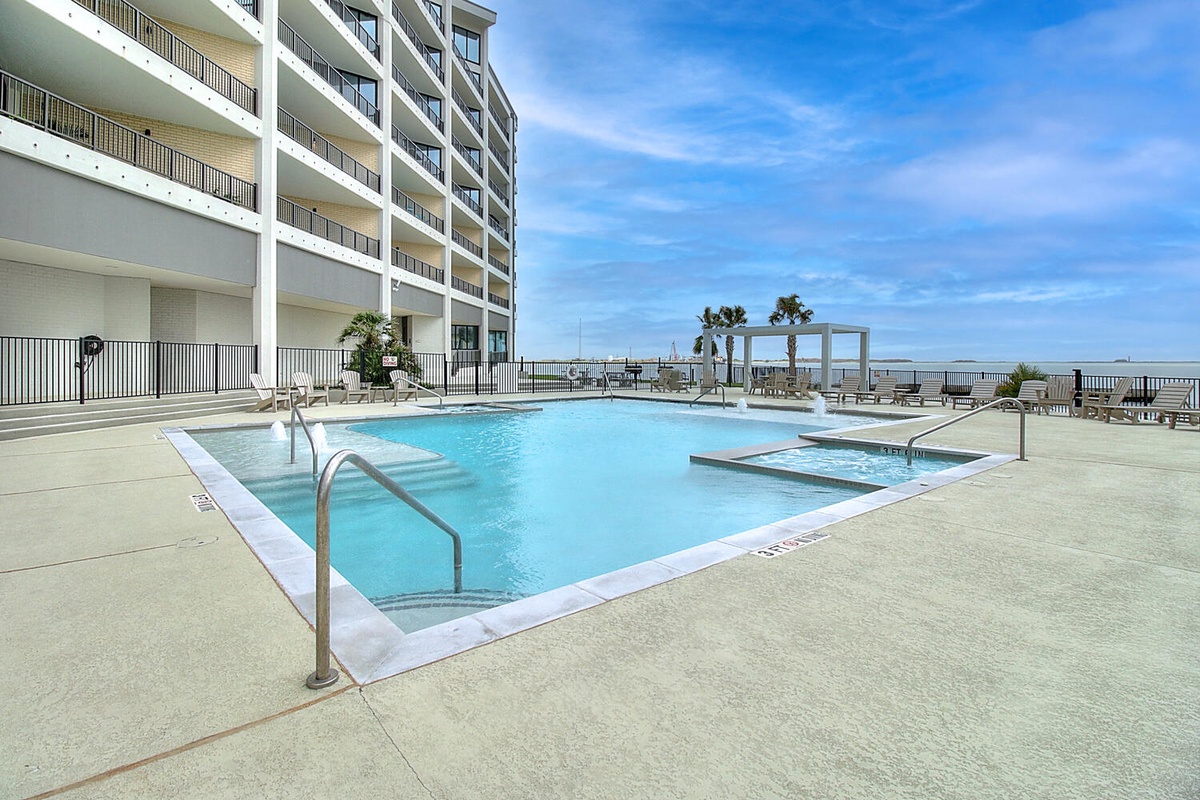 Dive into crystal-clear waters surrounded by modern comfort. Your poolside retreat offers stunning views and peaceful relaxation under endless blue skies.