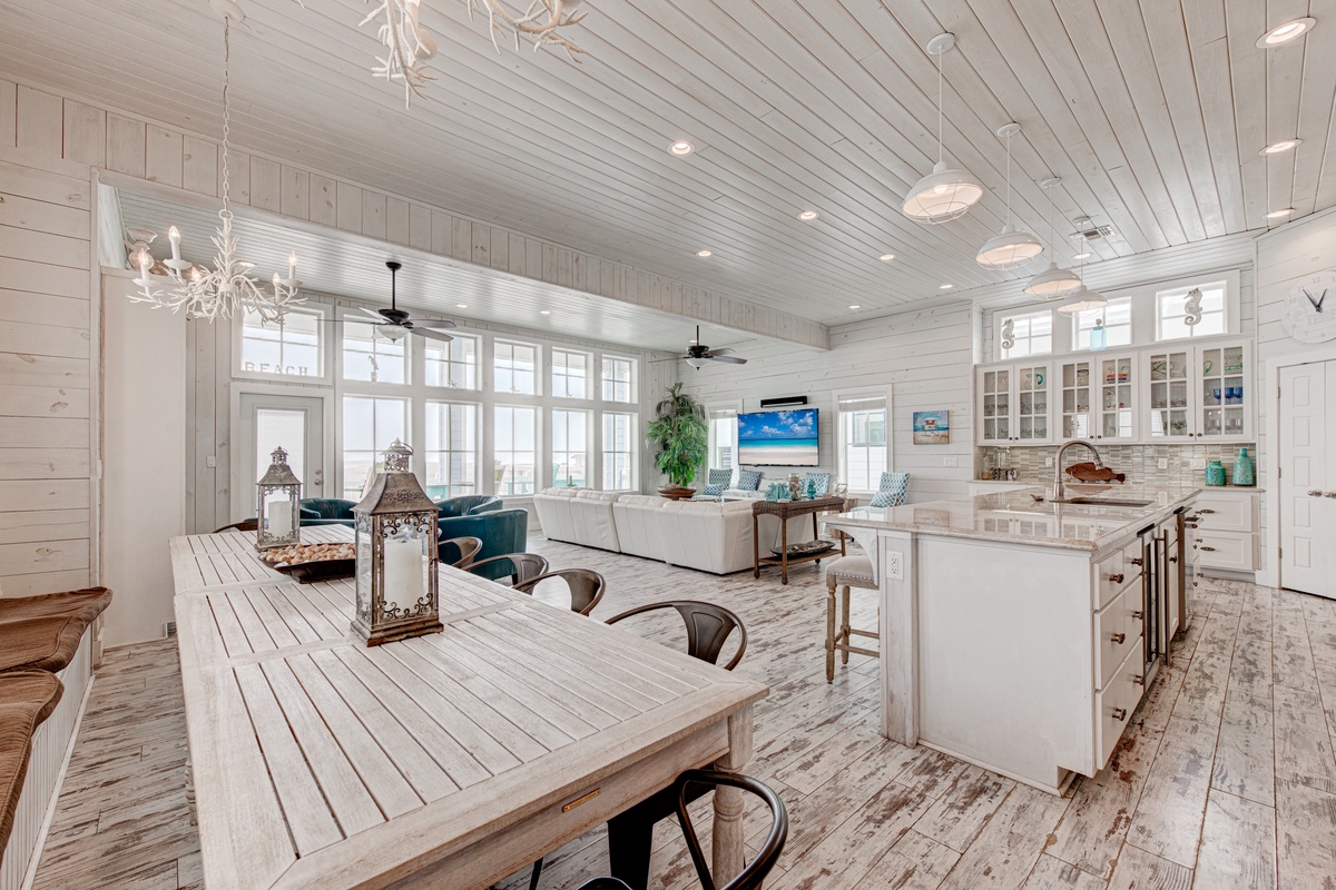 Step into your bright coastal haven where rustic charm meets modern comfort, perfect for gathering with loved ones.
