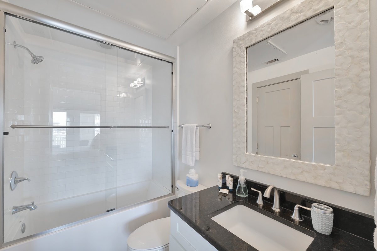 Luxurious marble bathroom with modern fixtures awaits your arrival. Elegant glass shower and spa-like finishes make your stay comfortable.