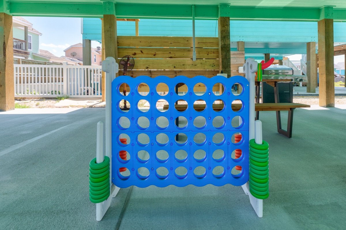 Your kids will love this giant Connect 4 game on the covered patio, perfect for family fun while you relax nearby.
