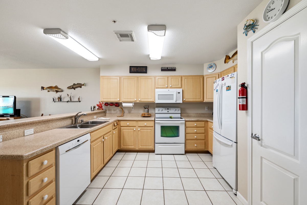Your fully equipped kitchen is ready for home-cooked meals, with modern appliances, ample counter space, and everything you need to feel right at home.
