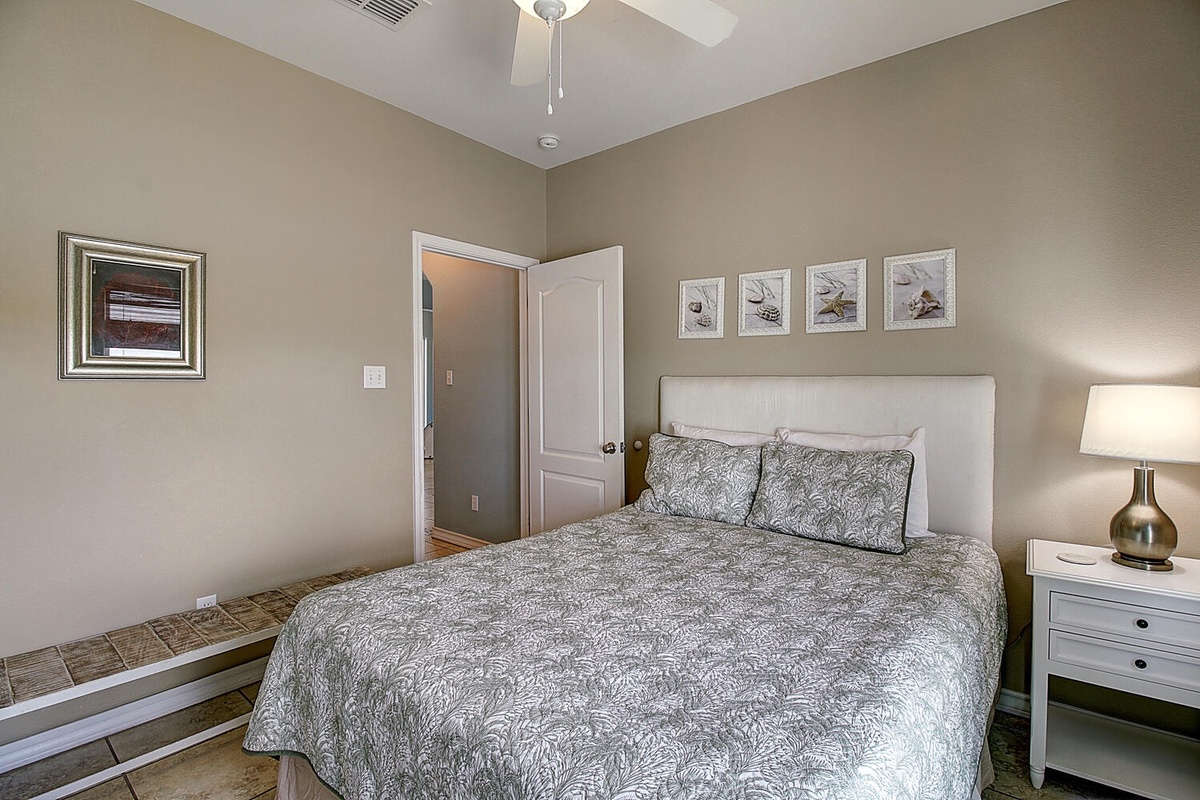 Sink into your comfortable bed surrounded by soothing neutral tones and gentle lighting for a peaceful night's rest.