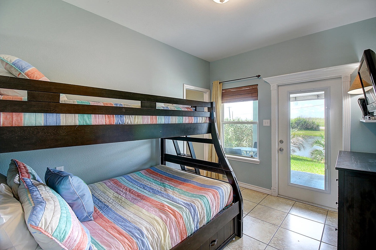 Drift off in your colorful bunk beds while garden views greet you through bright windows and patio doors.