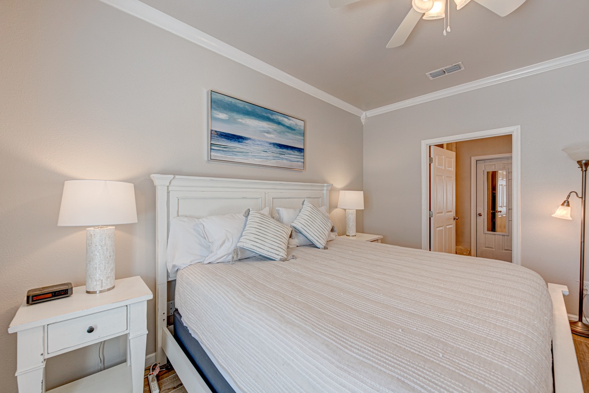 Drift off to peaceful dreams in your serene bedroom, where soft coastal hues and plush linens create the perfect retreat after a day of adventure.