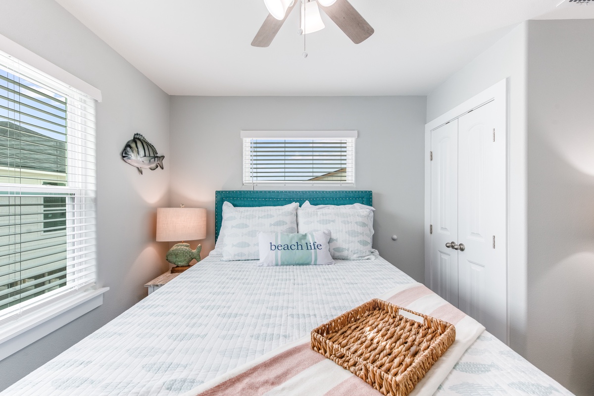 Drift off to sleep in your coastal retreat with soft linens and gentle ceiling fan breezes creating the perfect beachside sanctuary.