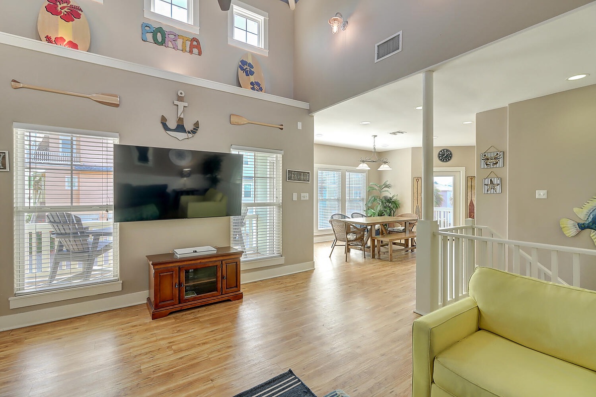 Relax in your bright, airy living space with gleaming hardwood floors, coastal décor, and an open layout perfect for gathering.
