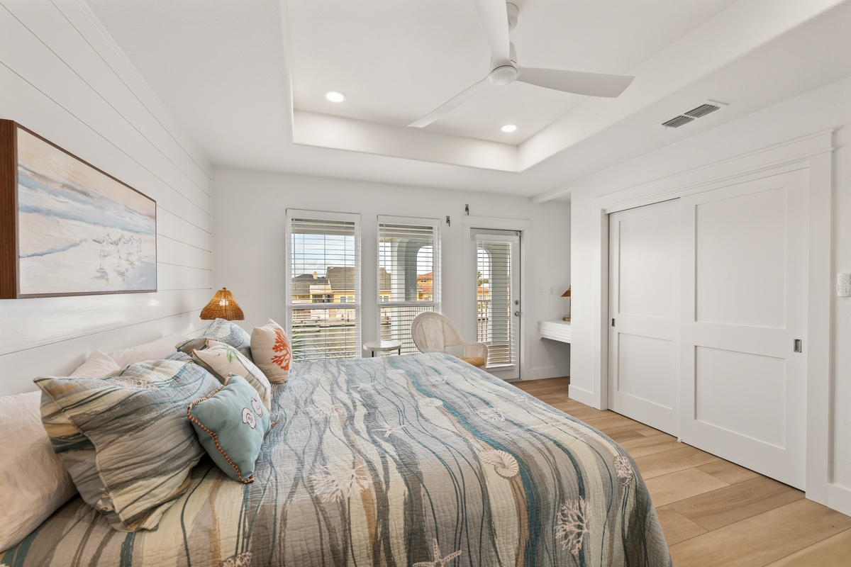 Slip into soft coastal linens and drift off beneath the gentle spin of your ceiling fan. Your serene bedroom opens to a private balcony, where morning light and sea air greet you.