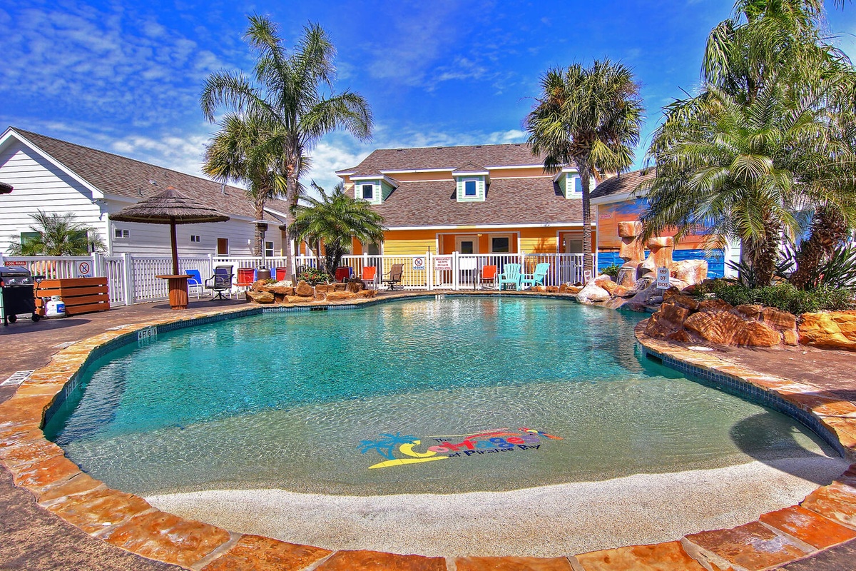 Dive into your tropical oasis! This sparkling pool beckons with crystal-clear waters, surrounded by swaying palms and warm Florida sunshine.
