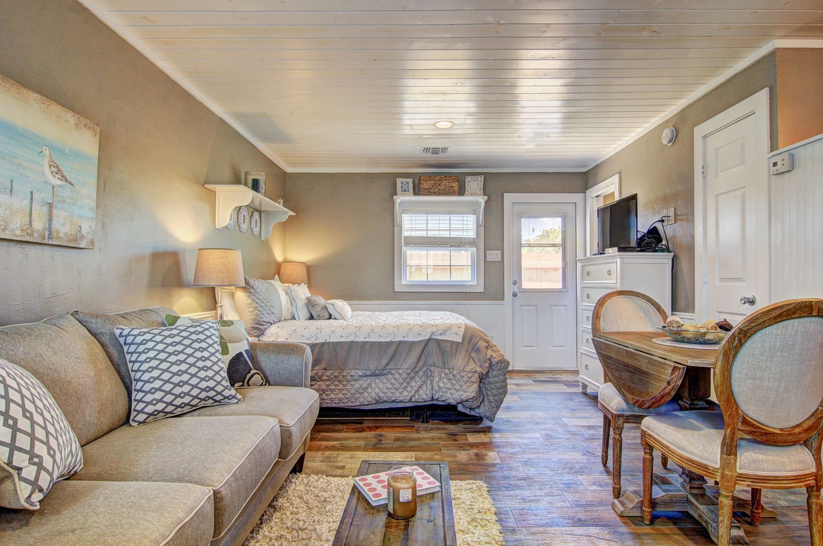 Your spacious studio blends comfort and style with a plush sofa, cozy bed, and charming dining nook—perfect for relaxing after exploring.