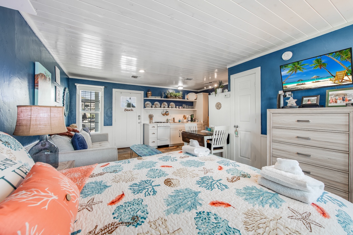 Drift off in this charming beach-themed room with coral reef bedding, ocean-blue walls, and your own kitchenette for morning coffee.