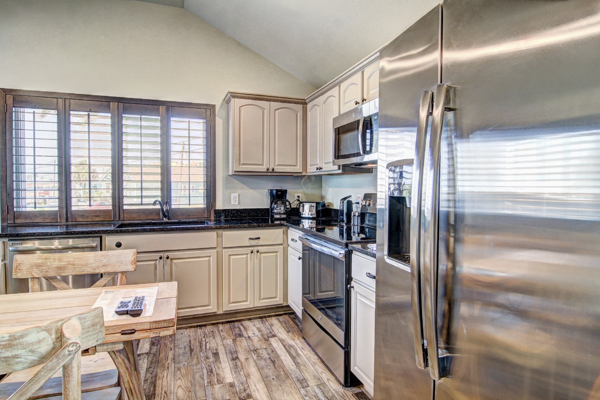 Your fully equipped kitchen features modern stainless steel appliances and plenty of counter space for preparing memorable meals together.
