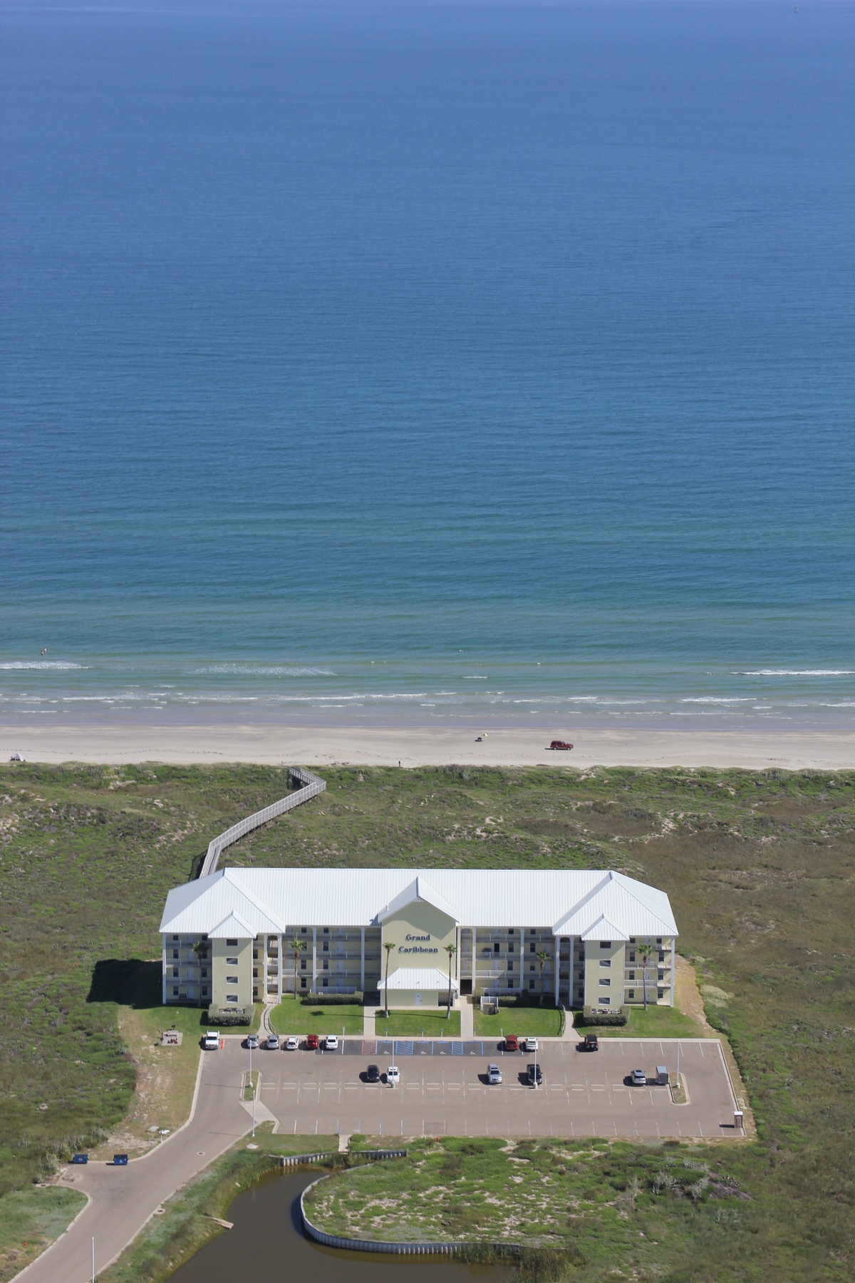 Beachfront property offers direct ocean access with expansive sandy shores and rolling waves just steps from the building.