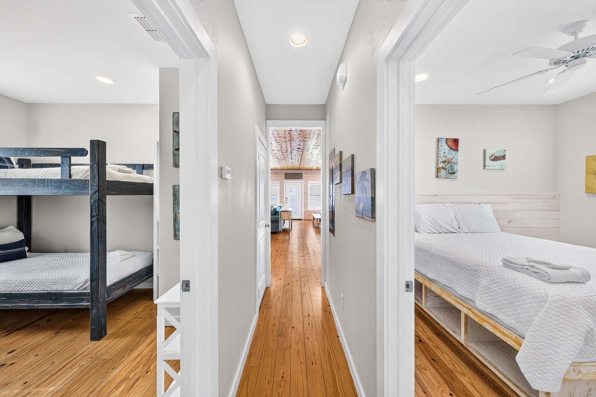 Your spacious sleeping quarters feature cozy bunk beds and a welcoming bedroom with warm wood floors, perfect for families or groups traveling together.