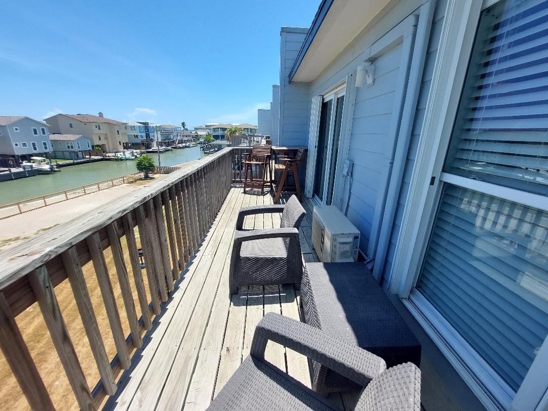 Relax on your private waterfront deck with comfortable seating while enjoying stunning canal views and gentle bay breezes.