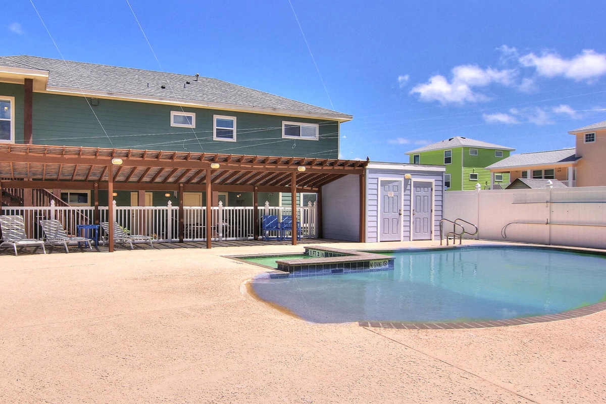Dive into your private pool oasis with a thrilling waterslide, surrounded by comfortable lounge chairs and a charming pergola for shade.