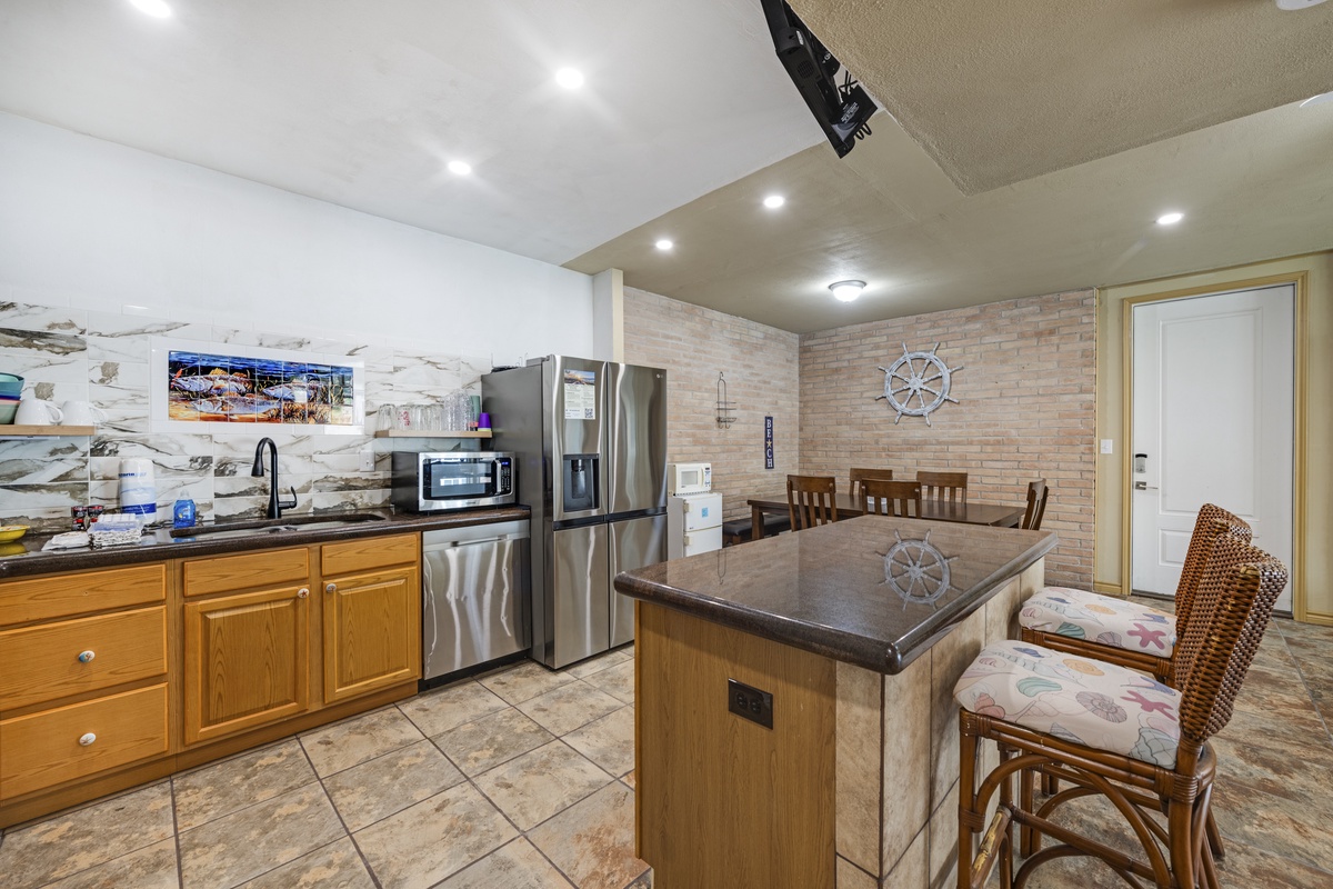 Your fully equipped kitchen invites you to whip up meals with stainless steel appliances, plenty of counter space, and a cozy breakfast bar where you can gather with loved ones over morning coffee.