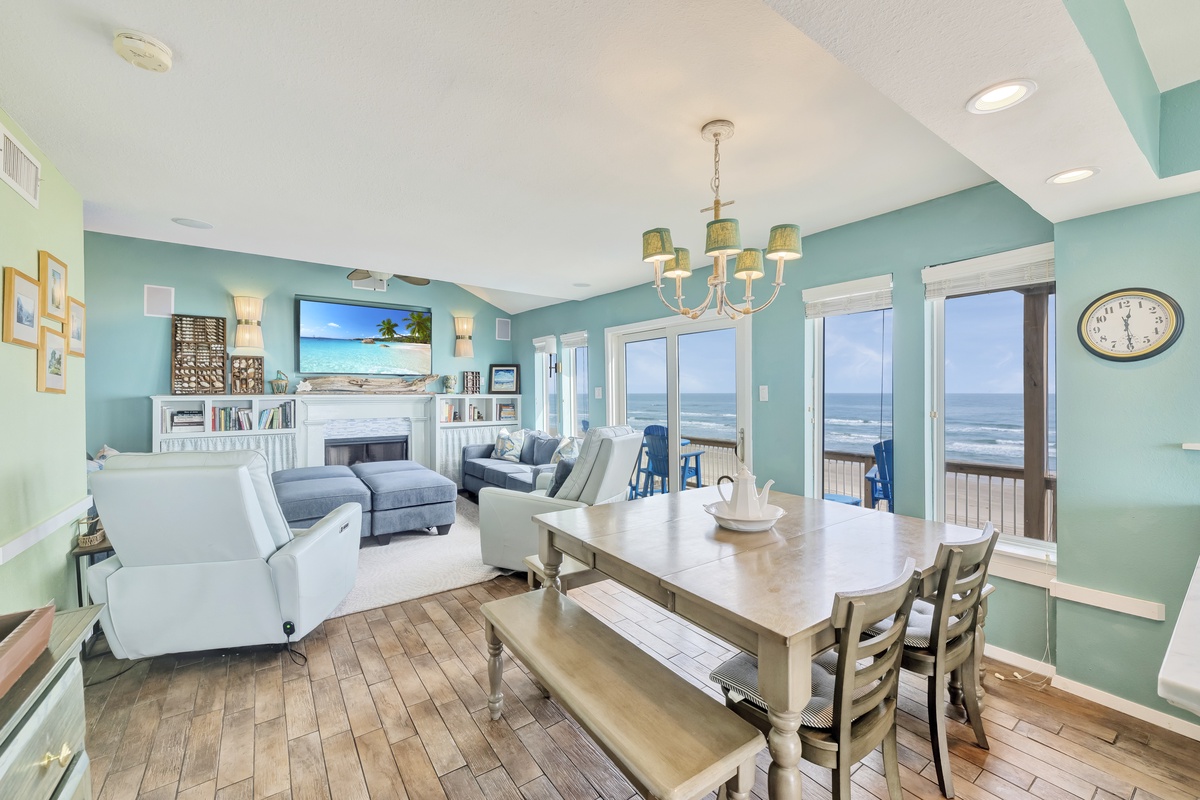 Your oceanfront retreat features an open living space where you can unwind on plush seating while watching waves roll in through panoramic windows.