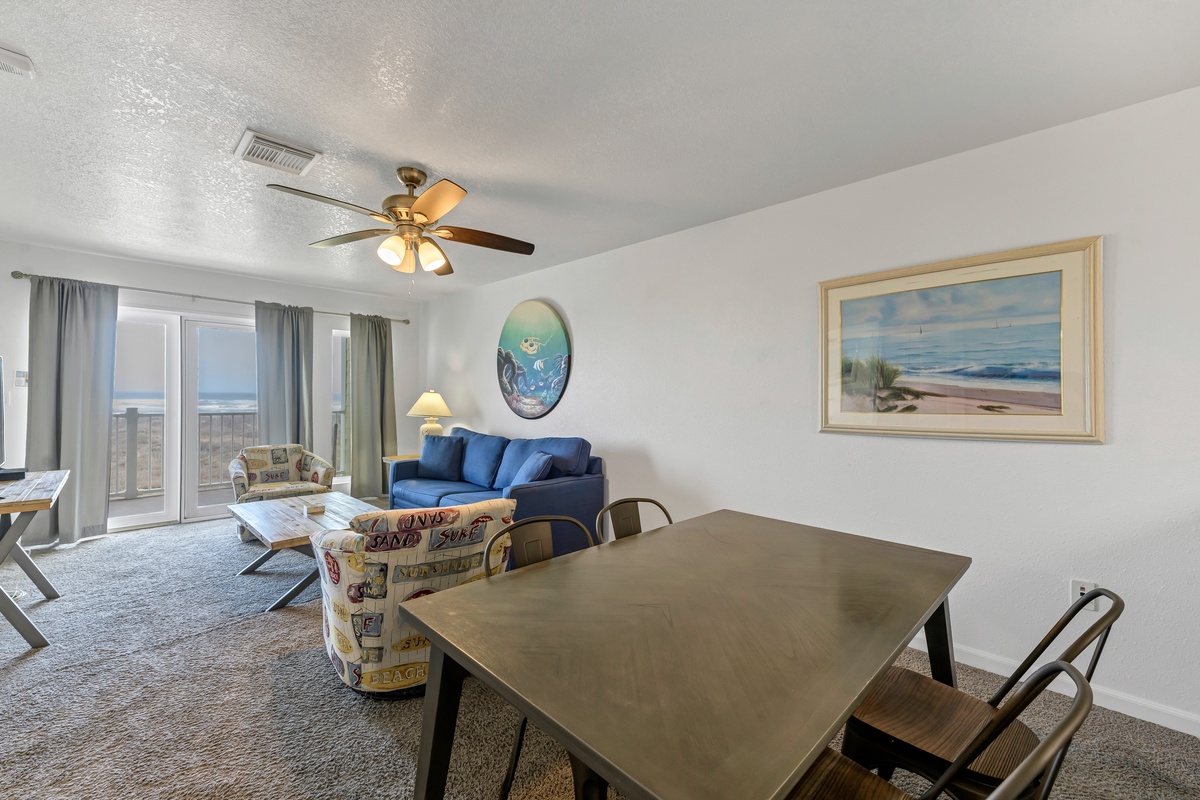 Relax in your spacious living area with ocean views, comfy seating, and beach-themed decor that makes you feel right at home.
