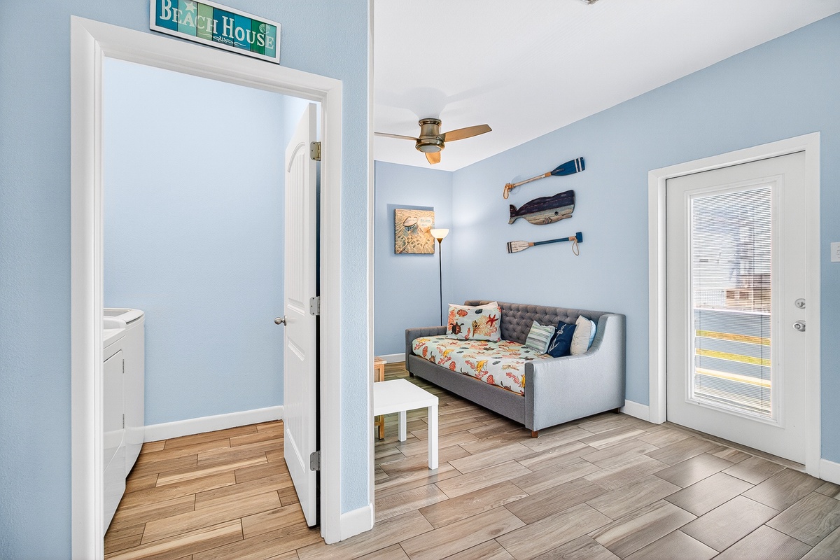 Relax in your charming coastal living room with nautical touches and comfortable seating that invites you to unwind after beach adventures.