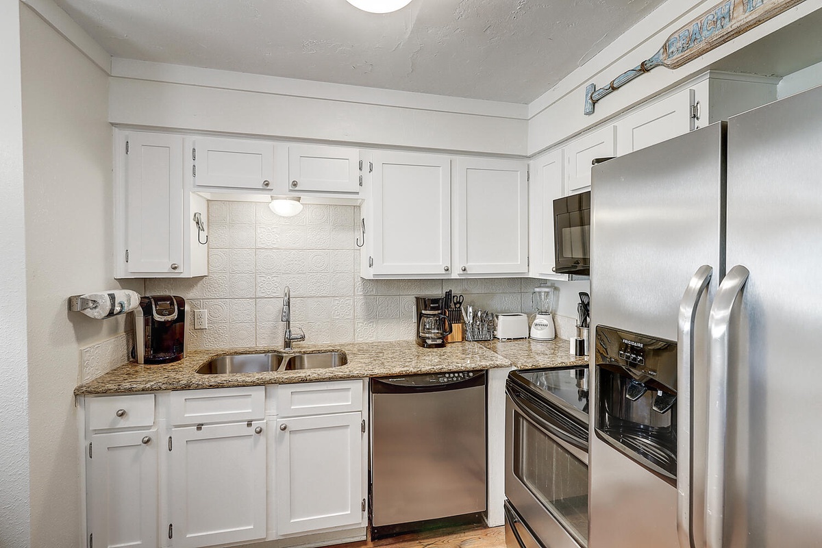 Your fully equipped kitchen features granite countertops, stainless steel appliances, and everything needed to prepare delicious meals during your stay.