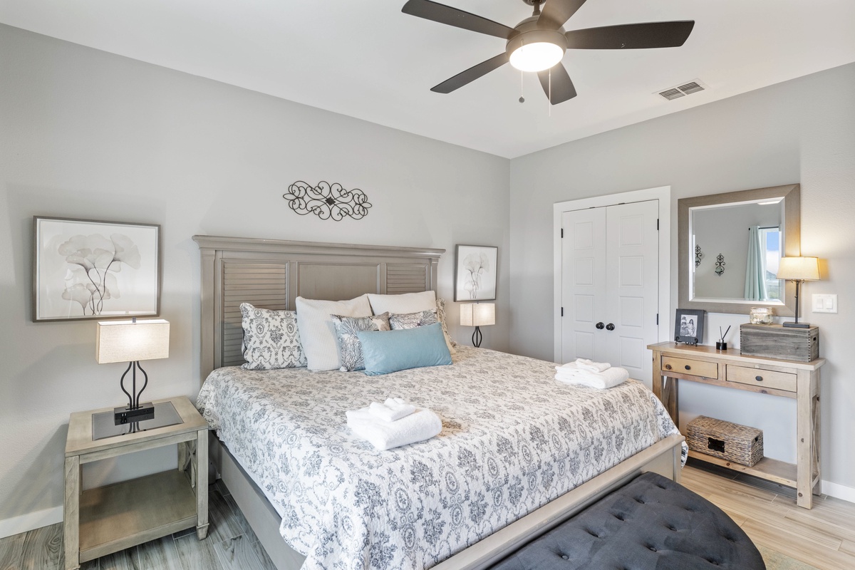 Drift off to peaceful sleep in your beautifully appointed bedroom, where soft linens and calming decor create the perfect retreat.