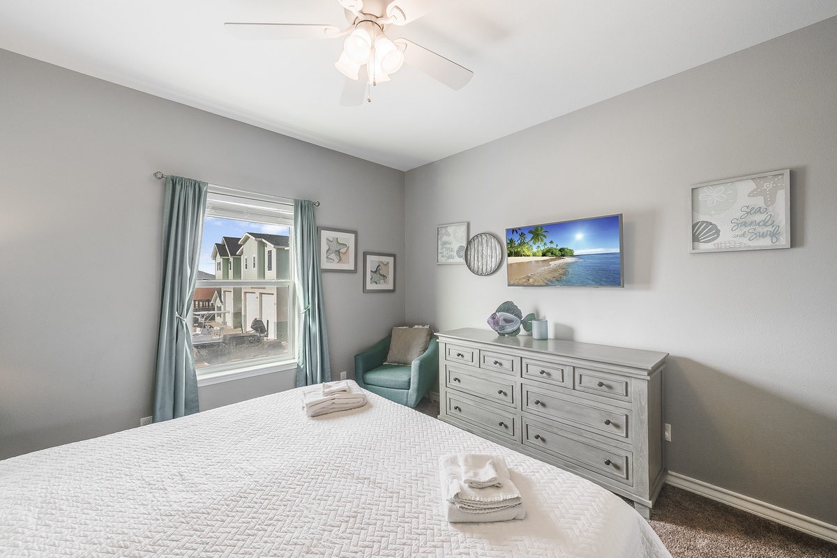 Unwind in your peaceful bedroom with coastal charm, featuring comfortable bedding, ample storage, and soothing ocean-themed decor to help you relax after each adventure.