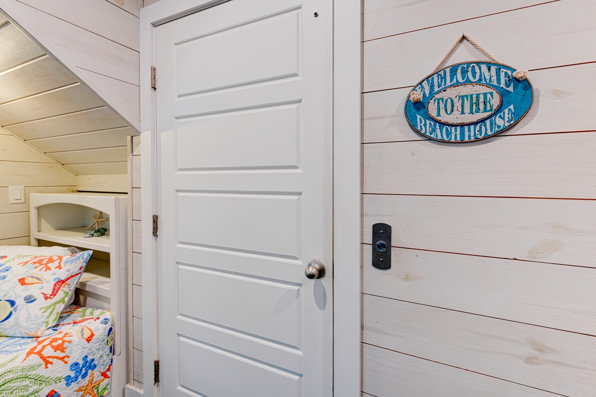 Your beachside retreat welcomes you with charming coastal decor and cozy bunk beds perfect for family adventures.