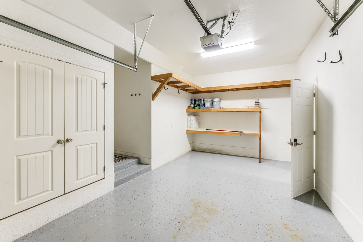 Your private garage offers secure parking plus bonus storage with sturdy shelving and organized workspace for your convenience.