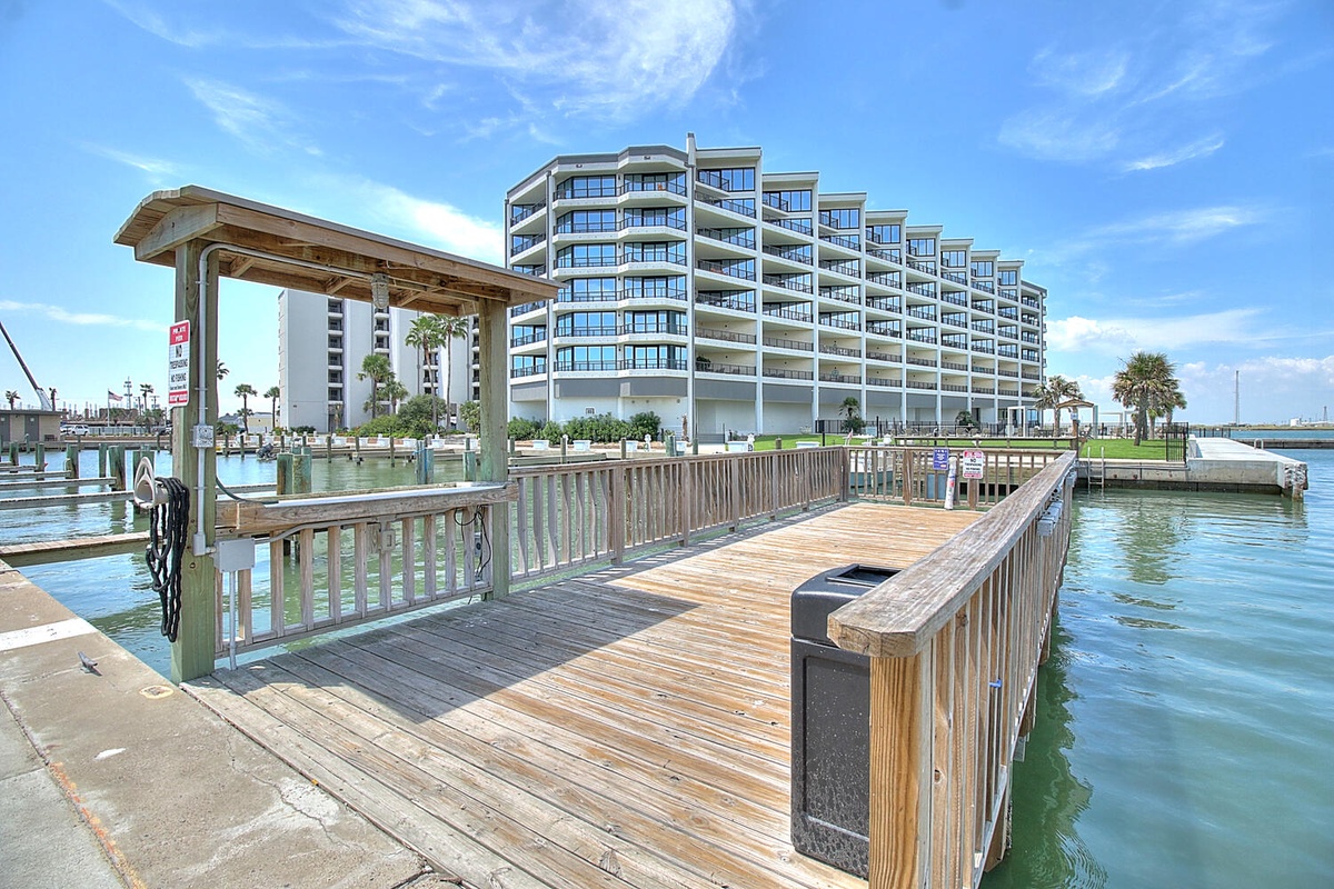 Waterfront resort building with private marina and boat docks offering direct water access.