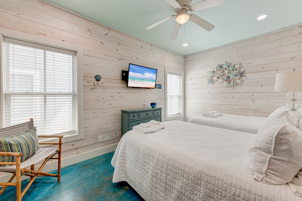 Drift off in this serene bedroom where whitewashed walls and soft linens create your peaceful coastal retreat.