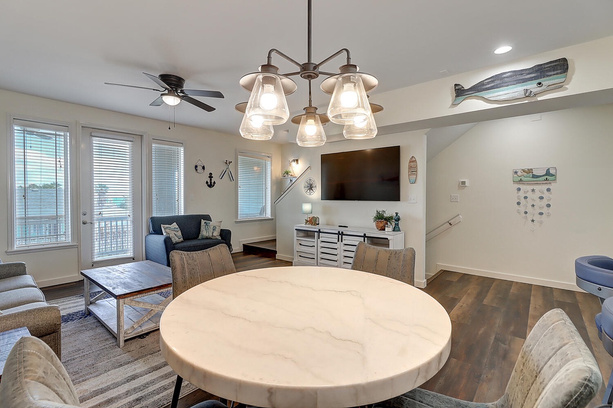 Relax in your bright coastal-themed living space with comfortable seating, modern amenities, and nautical touches throughout.