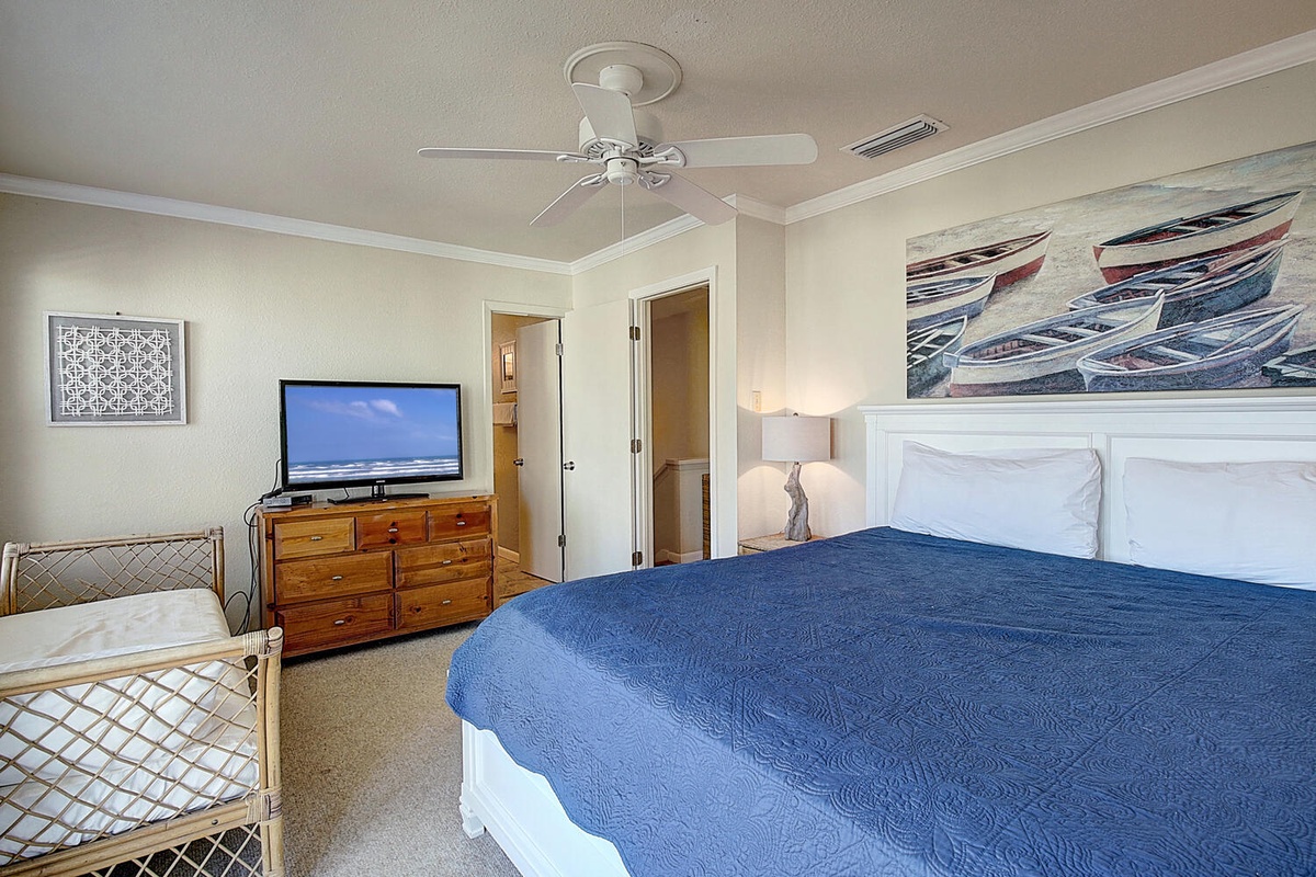 Drift into coastal dreams in your serene bedroom with ocean-inspired artwork and comfortable furnishings for the perfect night's rest.
