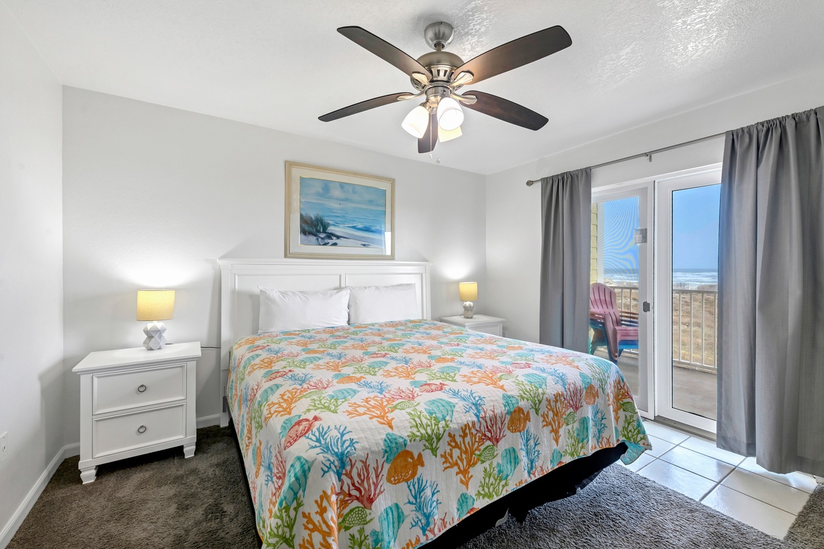 Drift off to sleep in your coastal bedroom with ocean-themed bedding and private balcony access overlooking stunning views.