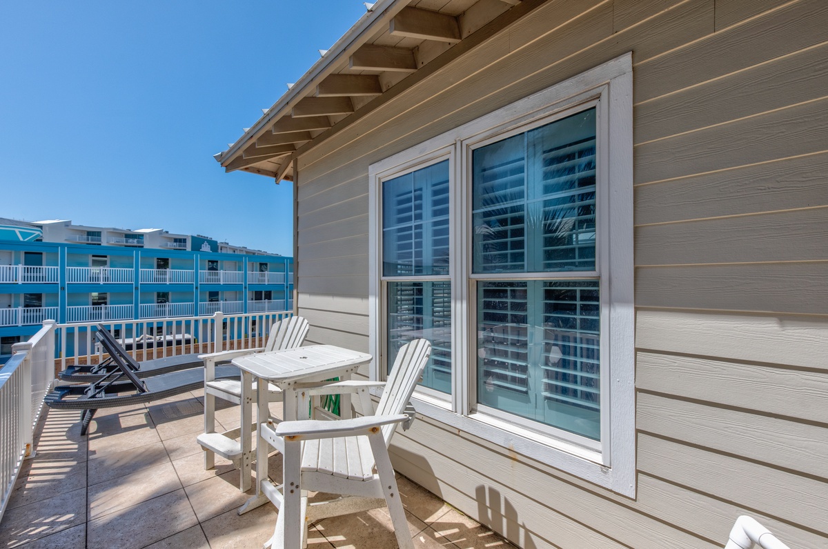 Unwind on your private balcony with comfortable seating and peaceful views of the surrounding area.