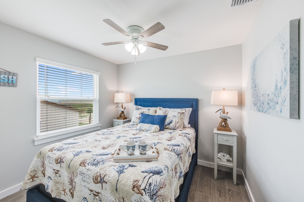 Drift off in this serene coastal bedroom where soft sea blues meet crisp whites, creating your perfect seaside sanctuary.