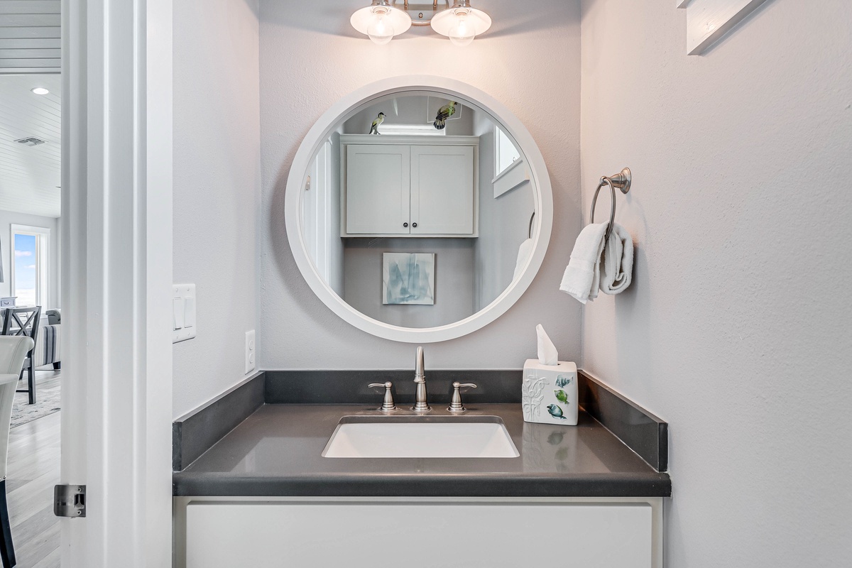 Your stylish vanity awaits with elegant marble counters, soft lighting, and thoughtful storage—perfect for your morning routine.