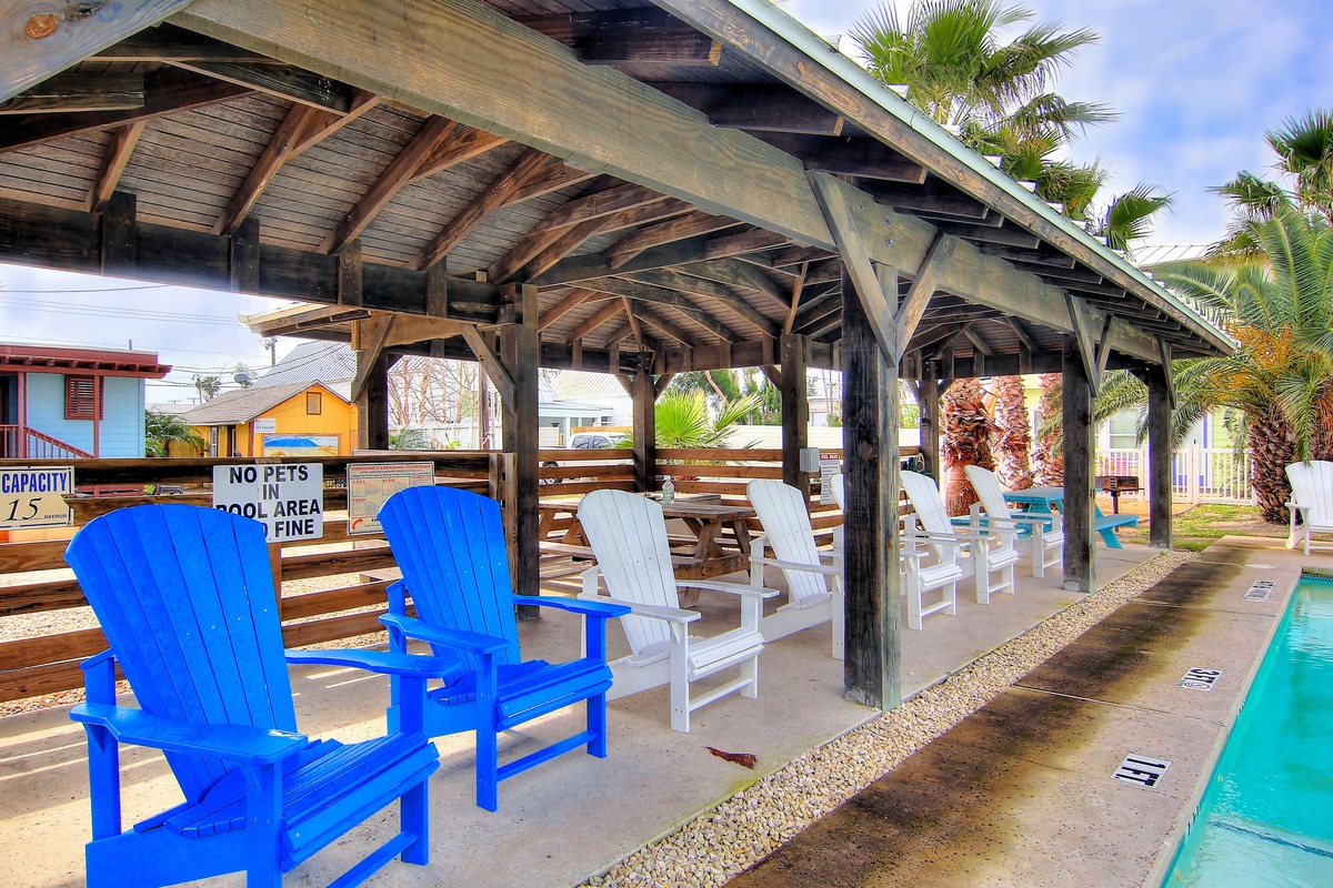 Relax in comfortable Adirondack chairs under the covered pavilion, where you can unwind poolside while staying cool in the shade.