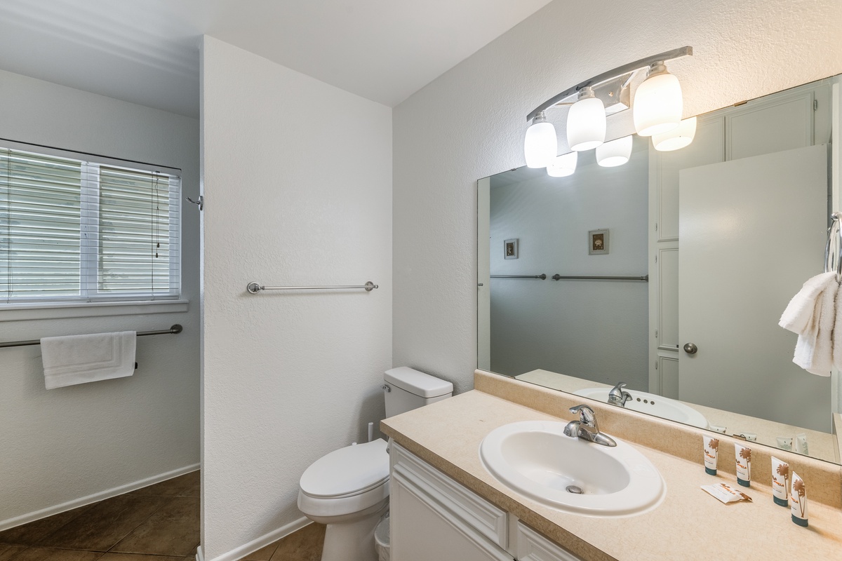 Freshen up in your private bathroom with bright vanity lighting, generous counter space, and thoughtful touches for your comfort.