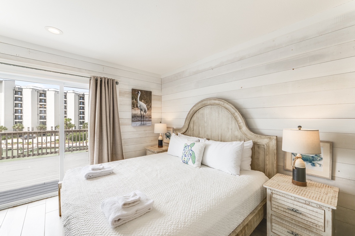 Slip into your coastal sanctuary and wake to soft morning light filtering through beachside curtains. Your serene retreat features crisp linens and charming decor that set the perfect tone for relaxation.