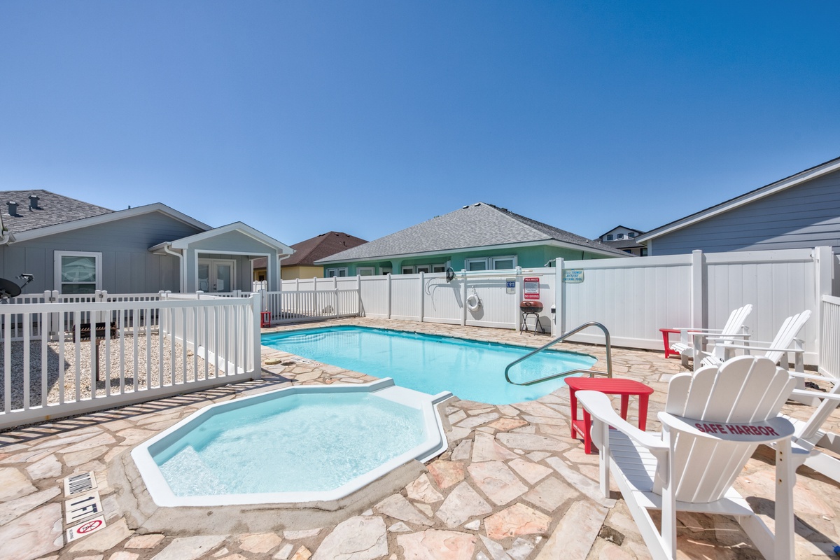 Dive into crystal-clear waters or soak in the hot tub while lounging poolside on comfortable chairs under sunny skies.