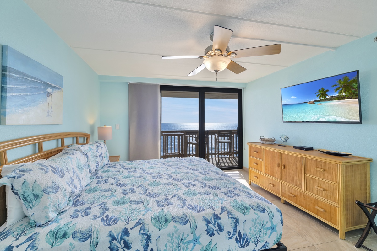 Drift off in coastal comfort with ocean-themed decor, while your private balcony frames stunning water views beyond.