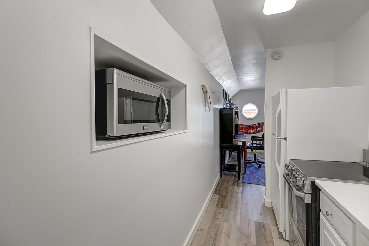 Your sleek galley kitchen features modern appliances and efficient design, perfect for preparing meals during your stay.