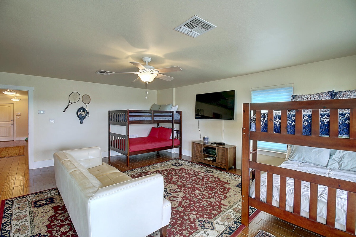 Your family room features bunk beds and comfy seating, perfect for kids to play while adults relax nearby.