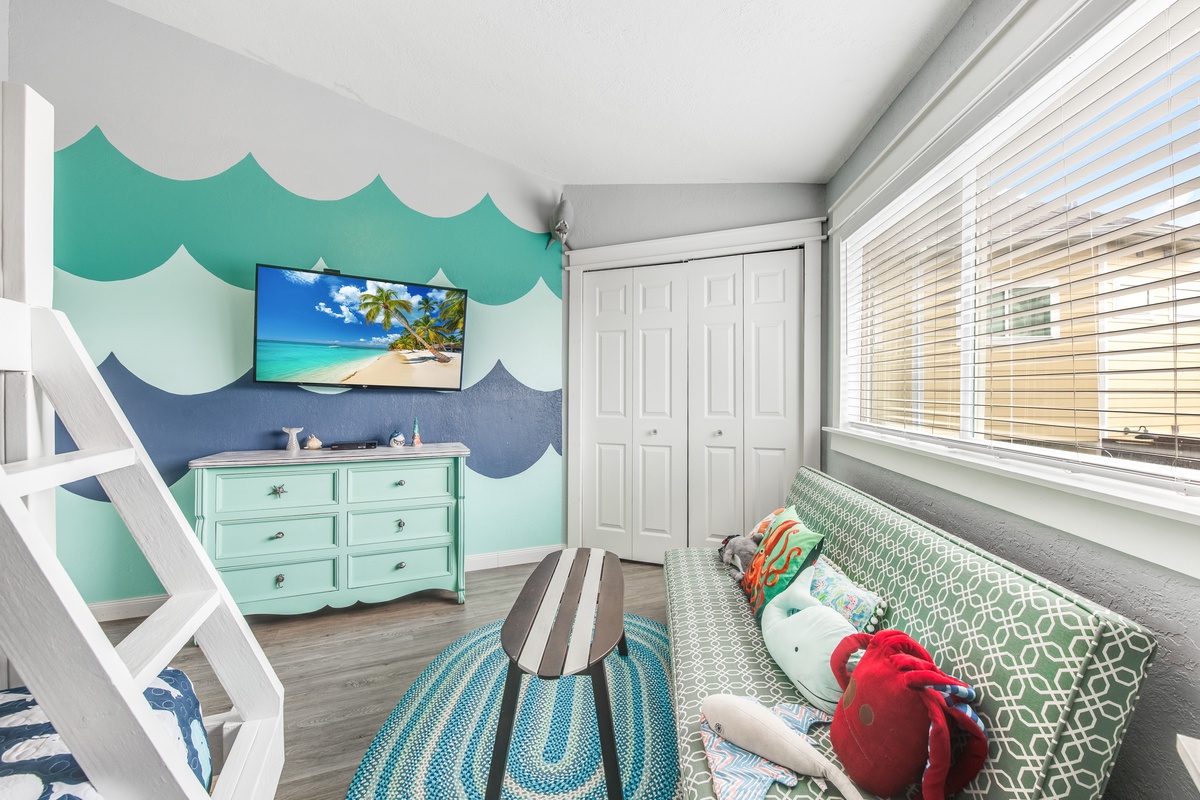 Your kids will love this ocean-themed room with bunk beds and beach vibes for sweet dreams.