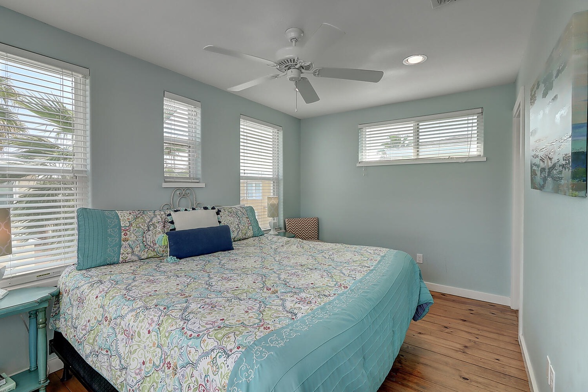 Drift into peaceful sleep surrounded by soft aqua walls and coastal charm in your bright, airy bedroom retreat.