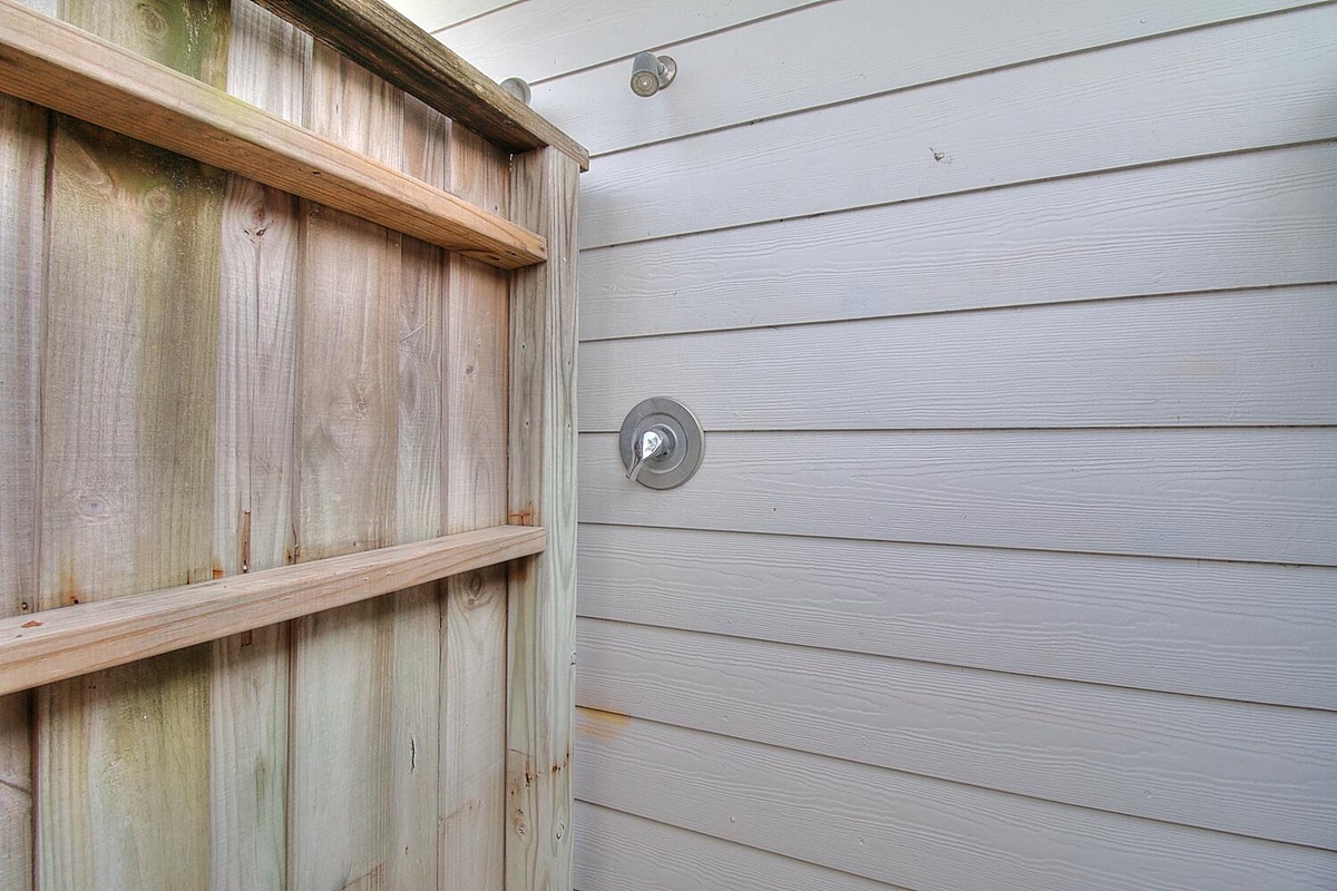 Rinse off under your private outdoor shower, surrounded by natural cedar fencing for complete privacy and relaxation.