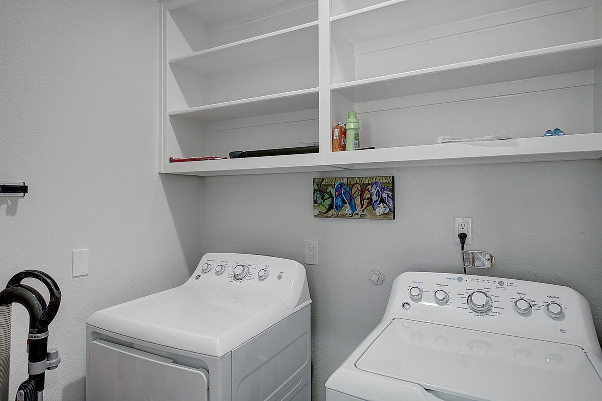 Your dedicated laundry space features full-size washer and dryer with ample storage shelving for all your vacation essentials.