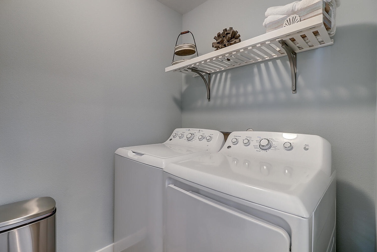 Your private laundry room features full-size washer and dryer with convenient shelving for your fresh towels and essentials.