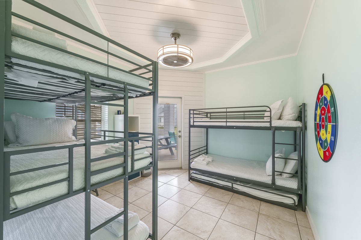 Your group will love this fun bunk room with multiple beds and a playful dartboard for evening entertainment.