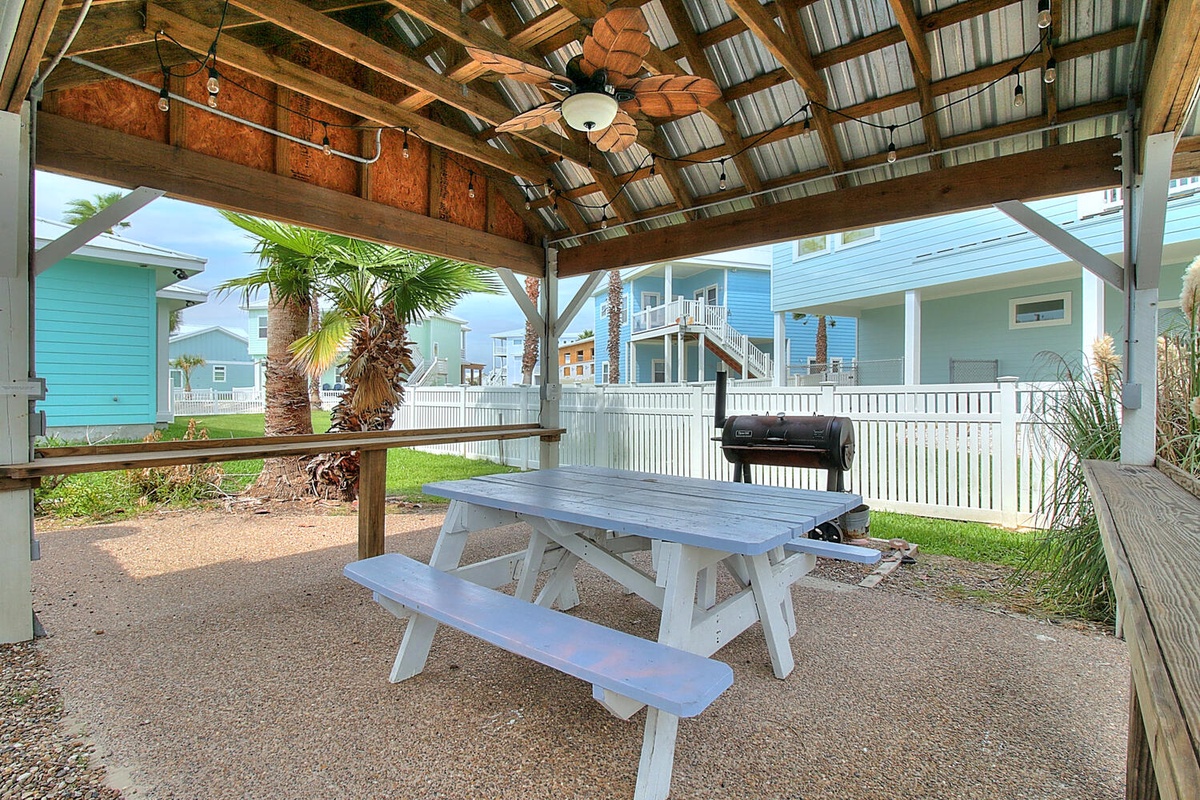 Gather around your private picnic table under the covered pavilion, where tropical breezes and a BBQ grill await your perfect outdoor meal.